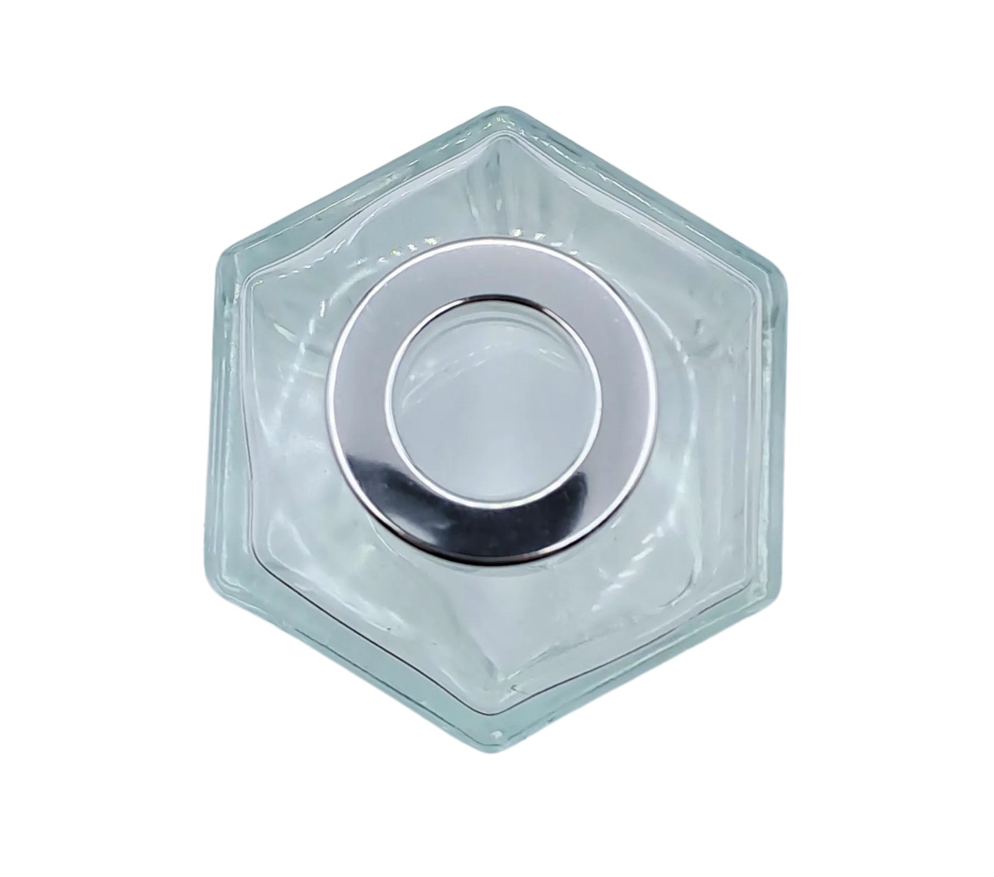 Bote 100 ml hexagonal transparente con tapón plateado para recarga de mikado. Plano cenital