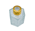 Bote 100 ml hexagonal transparente con tapón dorado para recarga de mikado