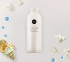 Bote de ambientador nebulización Aroma Flor Azul con fondo decorativo