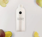 Bote de nebulización fragancia Ocecan Tropic con fondo decorativo